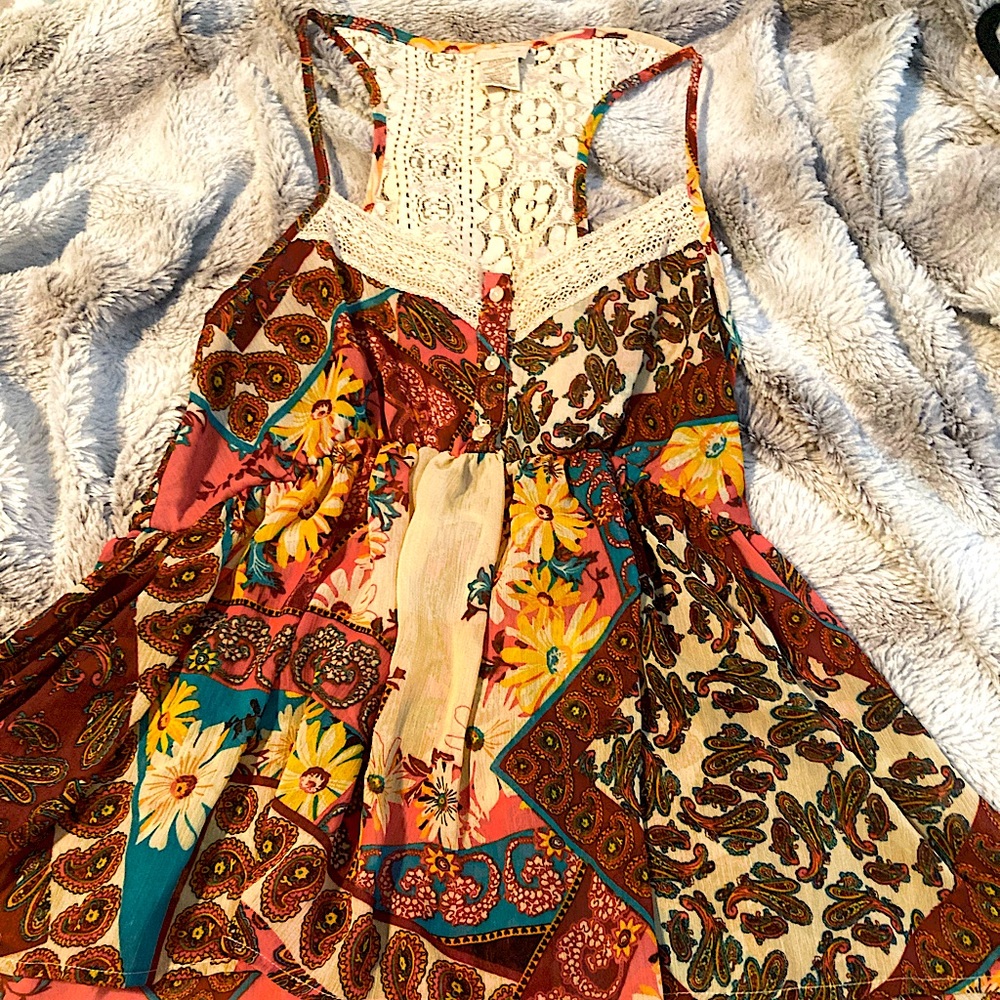 Day trip lightweight babydoll tank with lace detail.